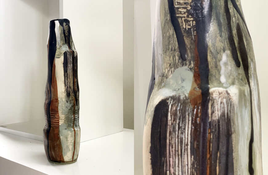 A large vase is sitting on a table in a room.