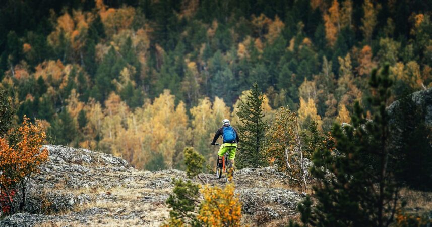 A person riding a mountain bike on a rocky trail.