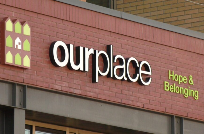 A building with a sign that says our place.
