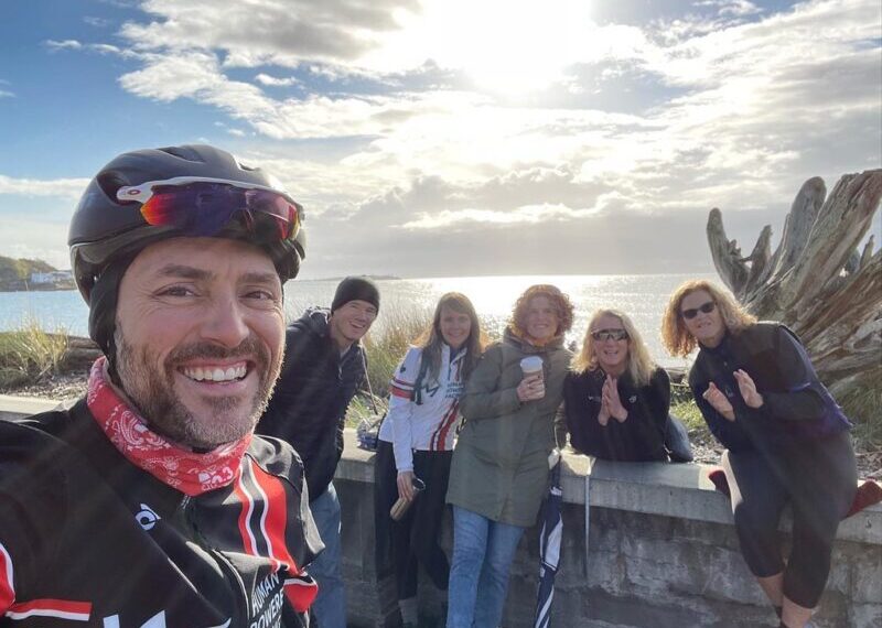 A group of cyclists posing for a photo.