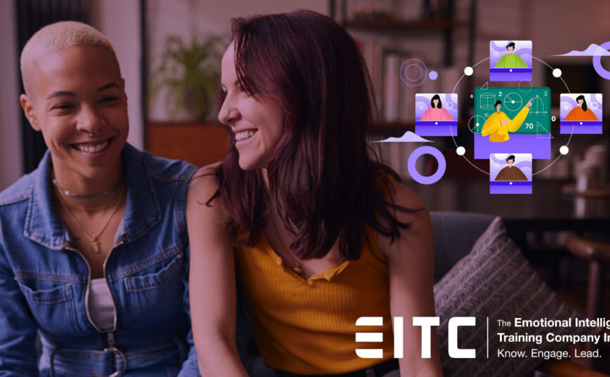 Two women are sitting in front of a computer screen with the words etc.
