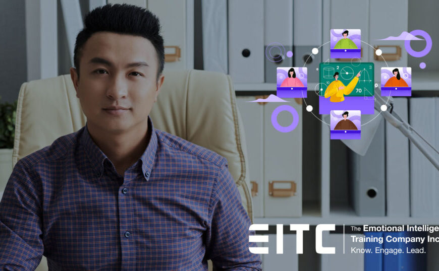 A man is sitting in front of a computer screen.