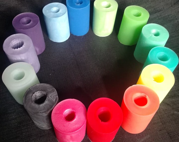 A group of colorful plastic tubes arranged in a circle.