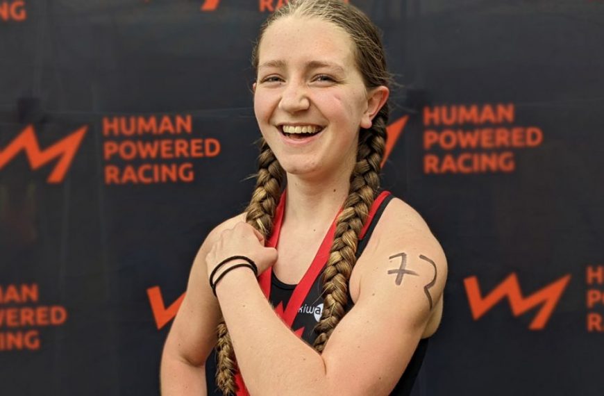 A young girl with a tattoo of human powered racing.