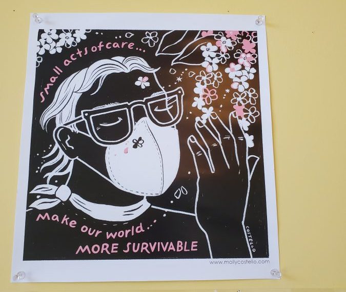 A poster with a picture of a woman wearing a mask.