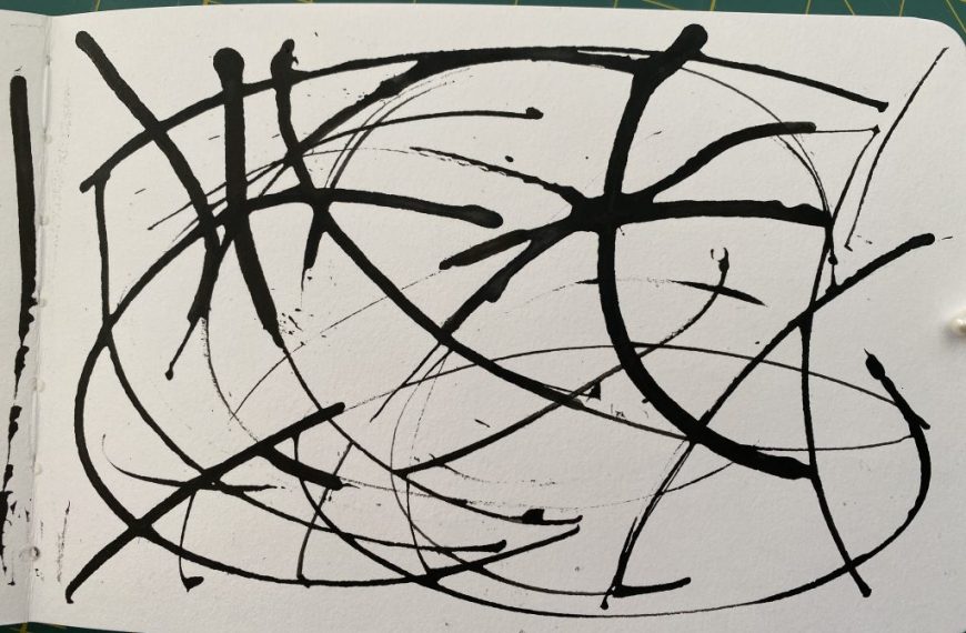 An open notebook with black ink on it.
