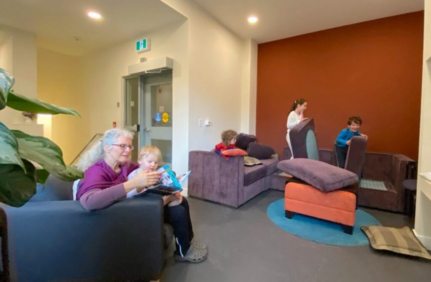 A group of people sitting in a living room.