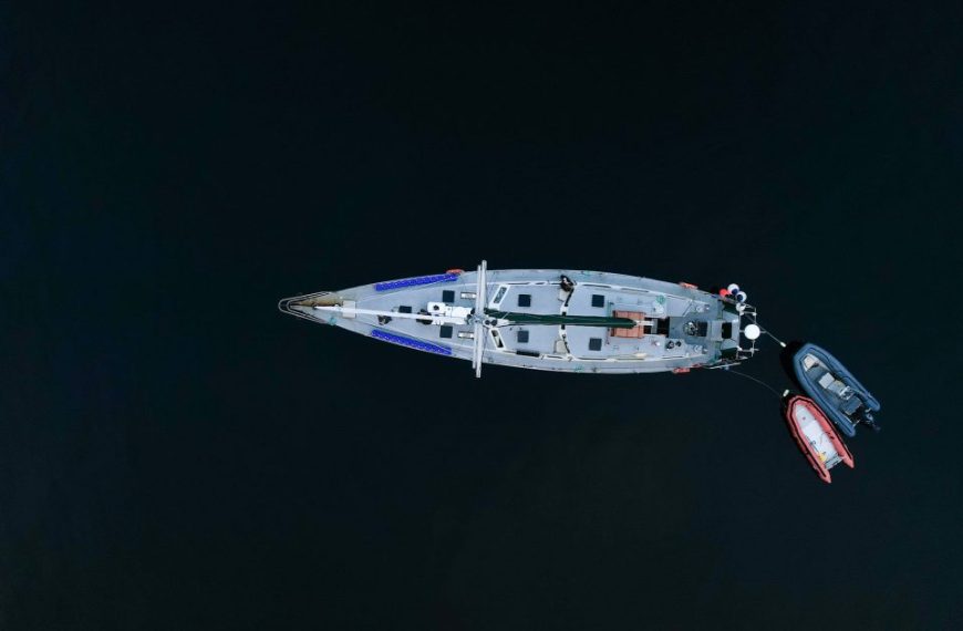An aerial view of a small boat in the water.