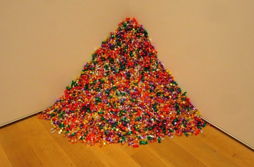 A pile of candy canes on a wooden floor.