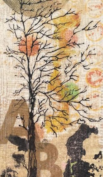 A piece of art with a tree in the background.