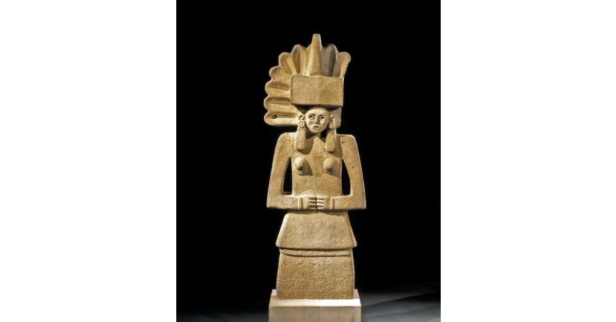 A wooden statue of an indian woman on a black background.