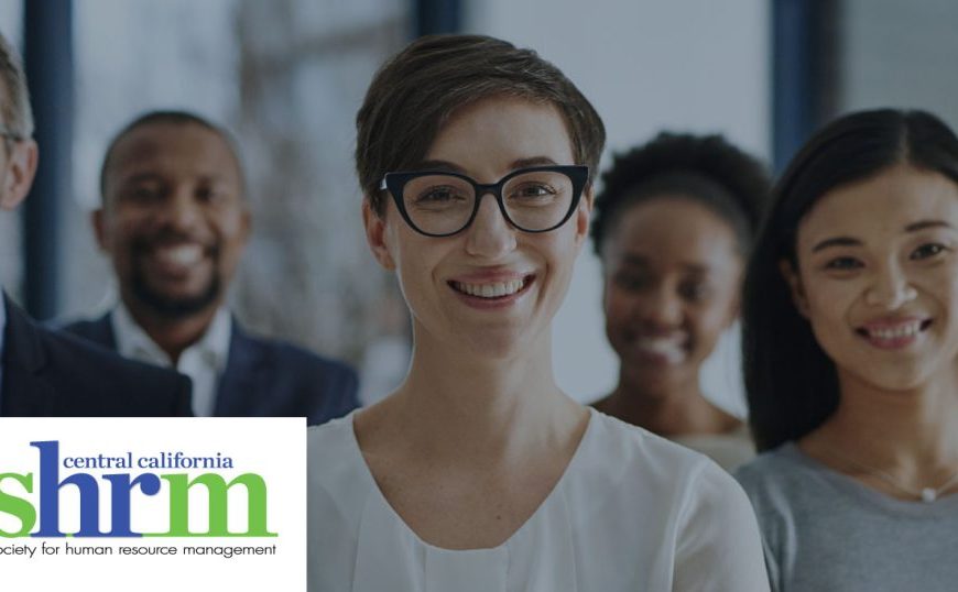 A group of people smiling in front of the srm logo.
