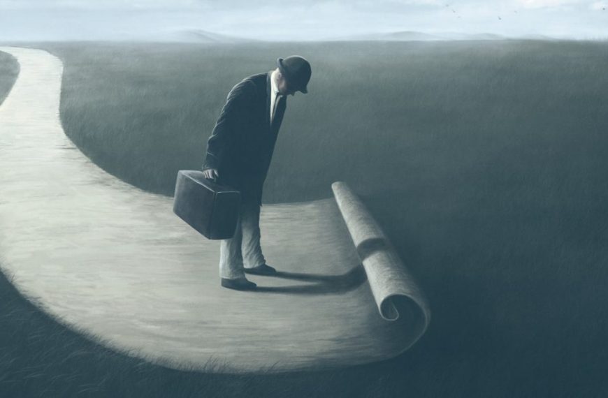 A man walking down a path with a briefcase.
