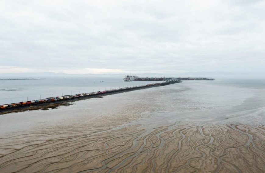 An aerial view of a pier in the water.