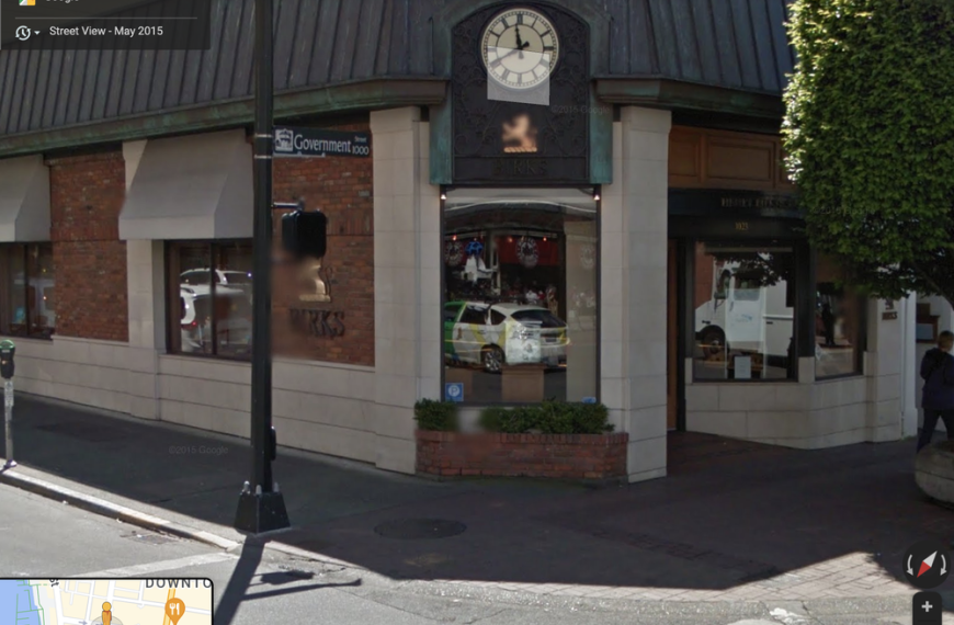 A google map of a store with a clock on it.