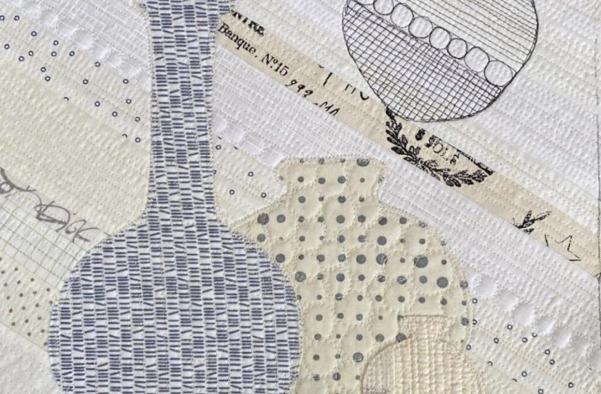 A quilted piece with vases and other objects.