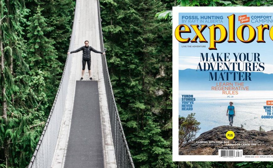 The cover of explore magazine with a person standing on a suspension bridge.
