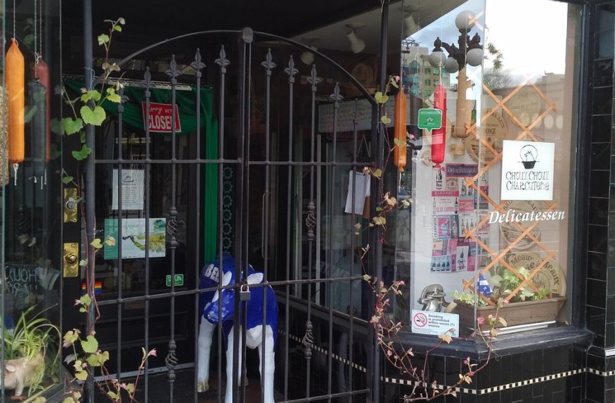 The front of a store with a gate.
