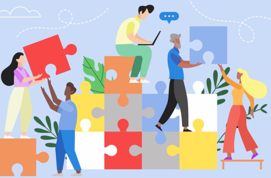 A group of people working together to build a puzzle.