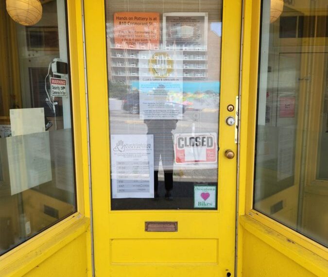 A yellow door with a number on it.
