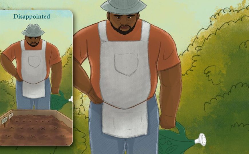 A man in an apron is standing in a field.