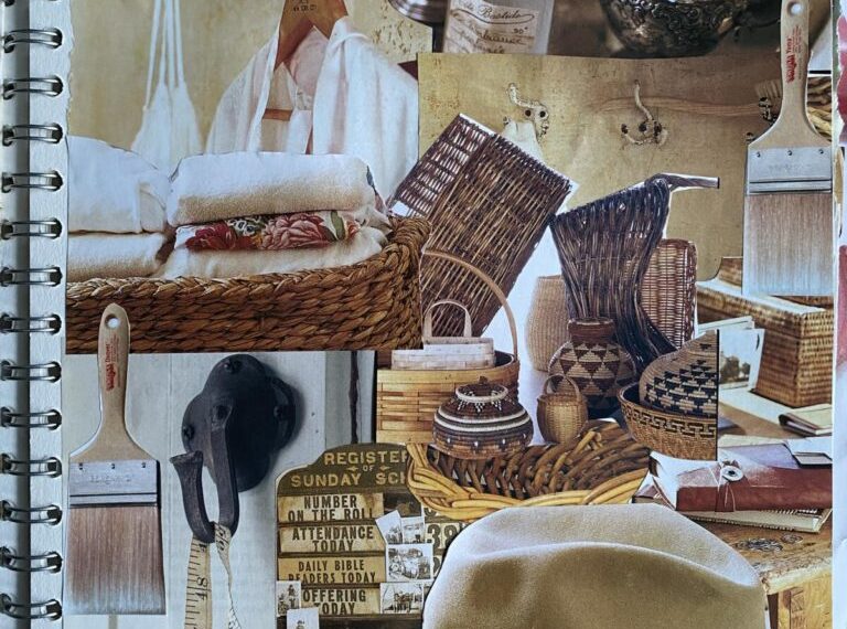 A spiral notebook with a hat and other items on it.