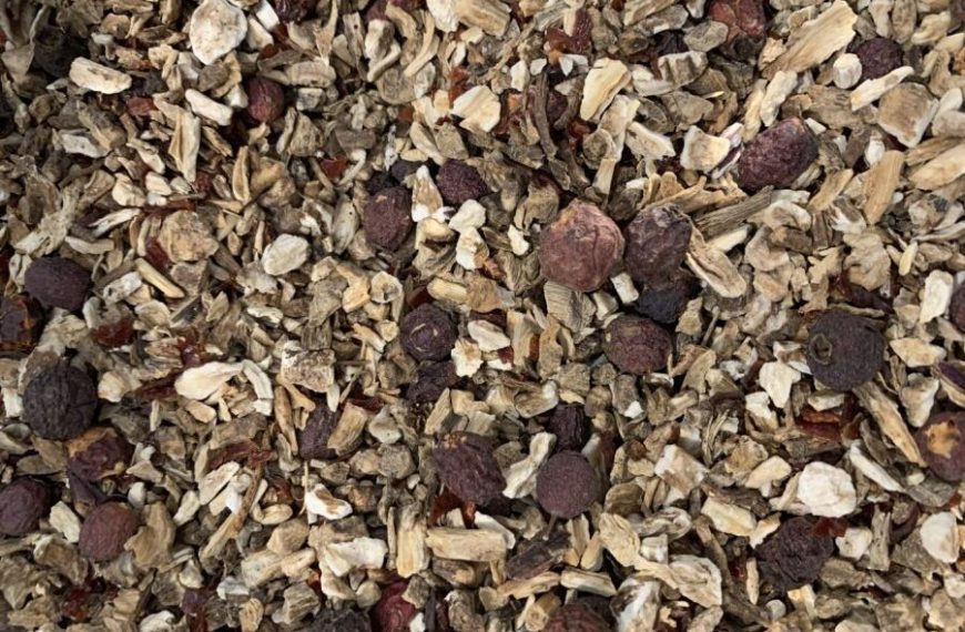 A close up of a pile of dried fruit and nuts.