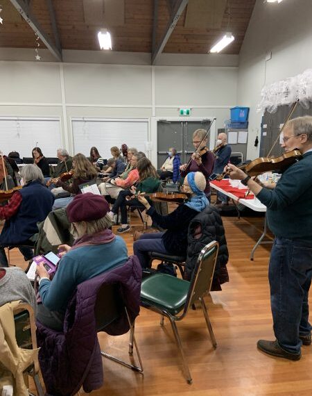 VFS students jamming on violins in a room in December.