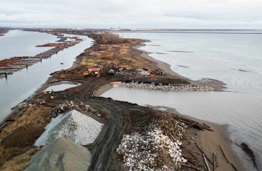 A complete construction site near the water.