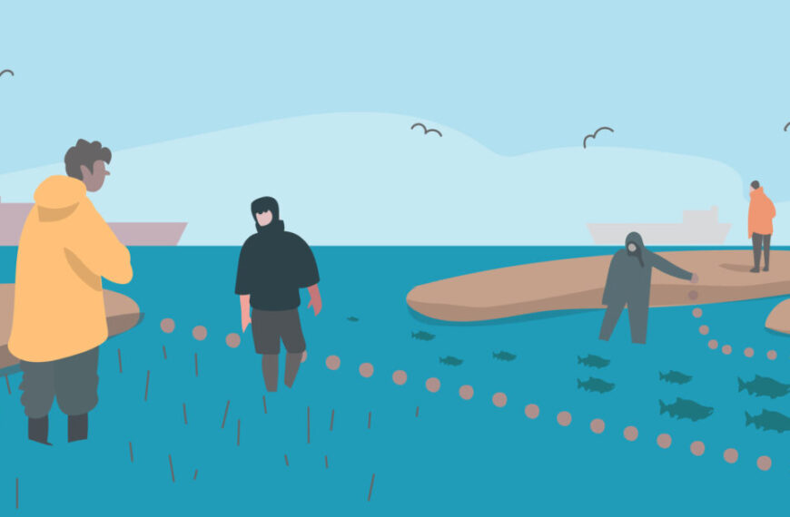 A group of people are standing on a rocky shore in the Fraser River Estuary habitat.