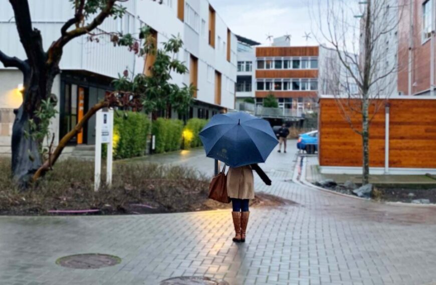 A woman walking down a sidewalk, symbolizing social connectedness.
