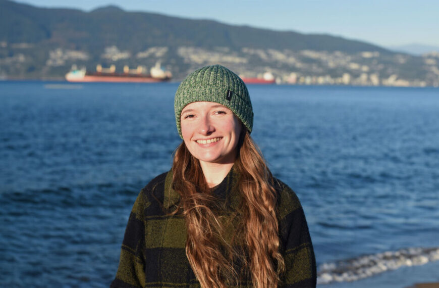 A young woman named Amy Rowley, a cetacean research scientist, is spotted wearing a beanie on the beach.