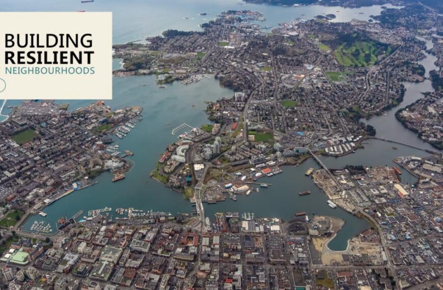 Aerial view of a coastal city with buildings, roads, and waterways. In the top-left corner, a logo reading "Building Resilient Neighbourhoods" with a house and bike image is displayed, symbolizing the community programs and partnerships that strengthen local connections.