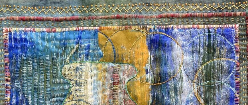Abstract textile artwork featuring intricate stitching and embroidery in blue, gold, and red threads. Circular and linear patterns invite the eye to rest on their harmonious interplay.