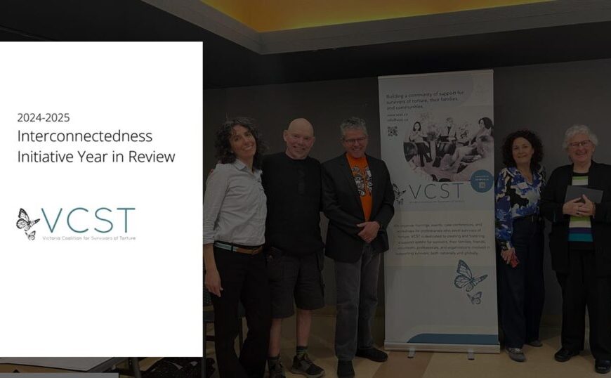 Six people stand beside a VCST banner and a display board titled "2024-2025 Interconnectedness Initiative Year in Review," highlighting the achievements of the year.